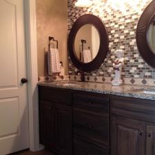 Shimmering Lusterstone walls and faux salvaged walnut glazed vanity